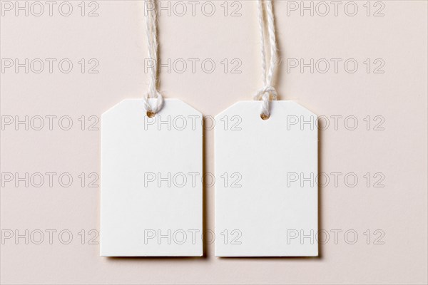 Top view empty labels arrangement beige background. Resolution and high quality beautiful photo