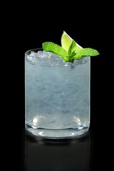 Rum cocktail with ice isolated on black