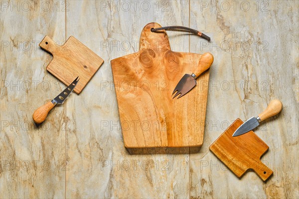 Top view of empty serving boards on wooden background