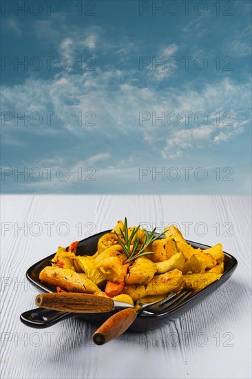 Spicy pumpkin and carrot baked in oven on ceramic plate