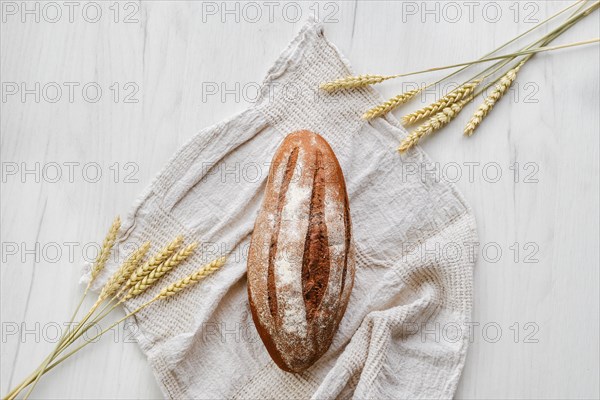 Overhead view of rue bread on light background