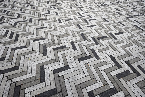 Creative structure with paving stones on sidewalk