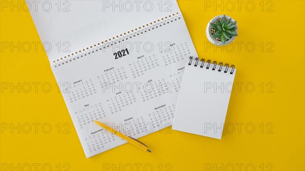 Flat lay calendar copy space notepad