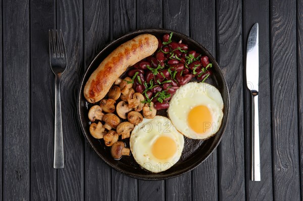 Cast-iron frying pan with fried eggs