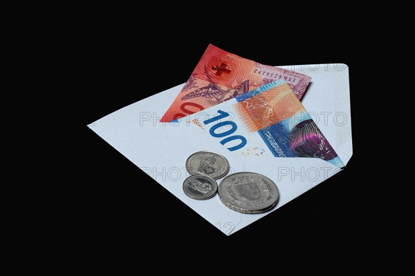Swiss banknotes and coins with envelope