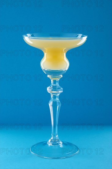 Old Cuban cocktail on blue background