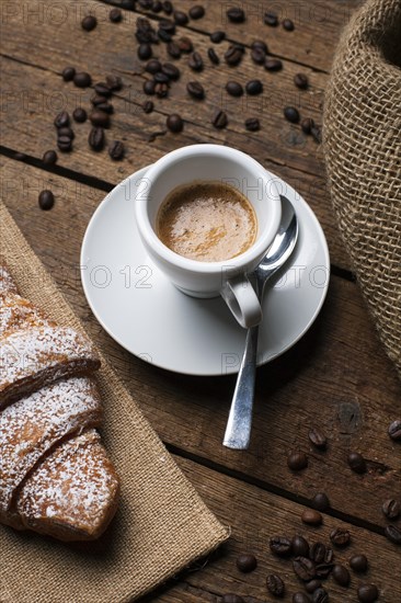 Espresso with croissant coffee seeds