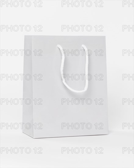 White paper shopping bag with handles. Resolution and high quality beautiful photo