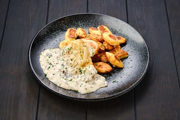 Roasted chicken fillet with gnocchi and mushroom sauce