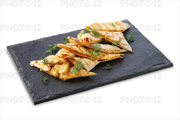 Portion of thin pita stuffed with melted cheese isolated on white background