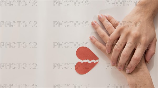 Top view hands with broken heart. Resolution and high quality beautiful photo