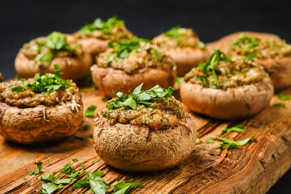 Closeup view of baked mushrooms stuffed with cheese