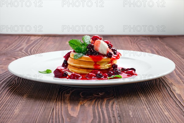 American pancakes with strawberry and black currant jam