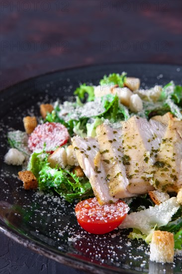 Fried chicken fillet with arugula