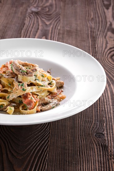 Pasta with bacon and squid