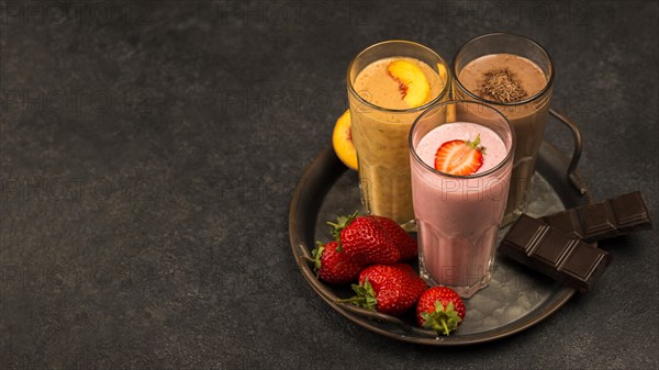 High angle assortment milkshakes with chocolate copy space