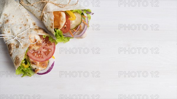 Kebab wrap with meat and vegetables with copy space
