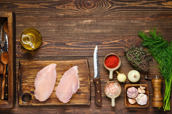 Culinary concept. Overhead view of kitchen table with chicken fillet