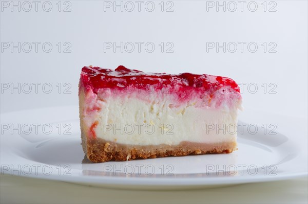 Portion of cherry cheesecake on a plate