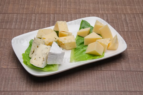 Plate with three kinds of cheese. Cheeseboard