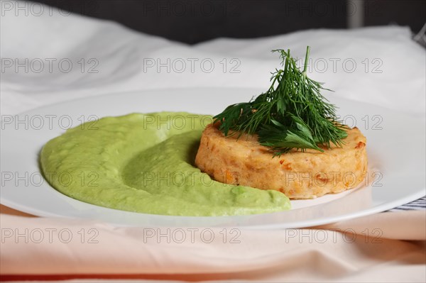 Salmon rissole with peas puree