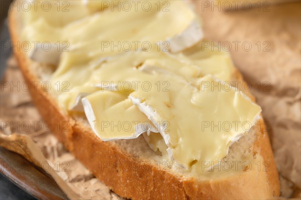 Macro photo with shallow depth of field of bread with brie cheese