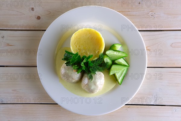 Meatballs with creamy sauce and mashed potato