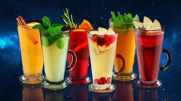 Set of tasty fruit tea in cups