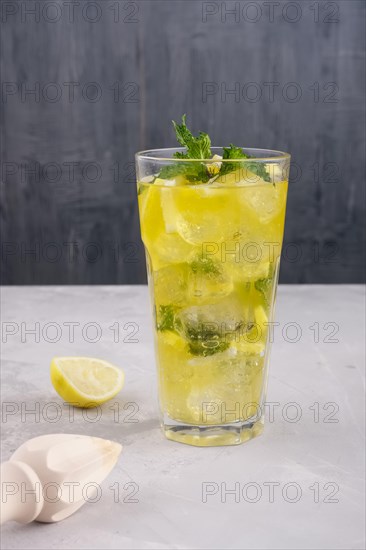 Faceted tall glass with cold citrus lemonade