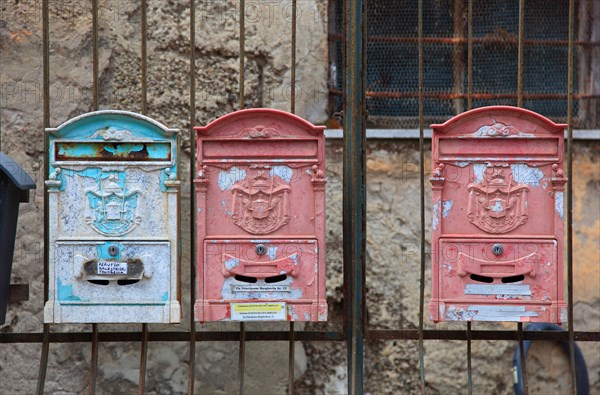 Colourful old mailboxes