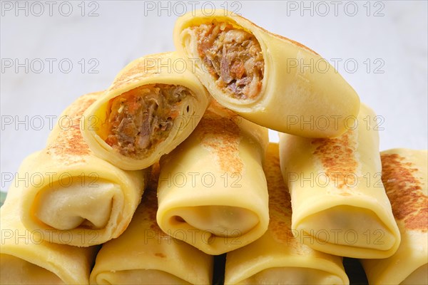 Thin crepe stuffed with chicken offal