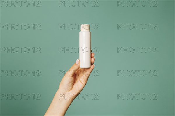 Cosmetic product female hand