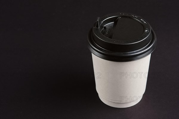 Cardboard cup with lid. Place for text