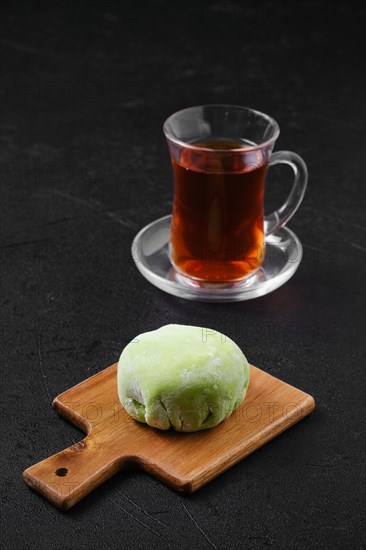 Sweet dessert mochi with kiwi with fruit tea