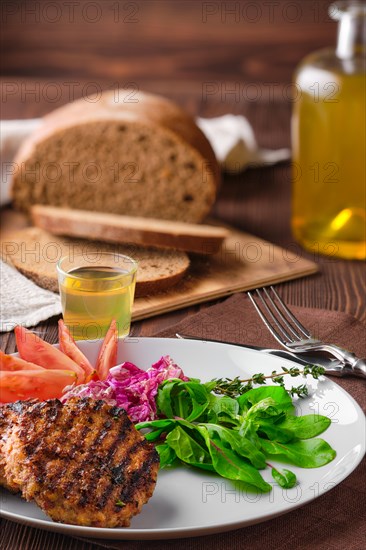 Grilled beef cutlet with fresh salad