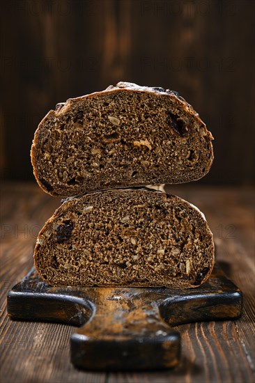 Closeup view of fresh rye brown bread on wooden cutting board