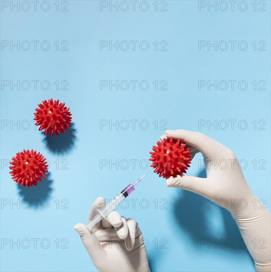 Top view hand holding virus with syringe. Resolution and high quality beautiful photo