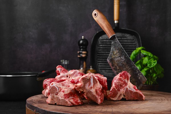 Chopped beef bones for making bouillon stock on wooden stump