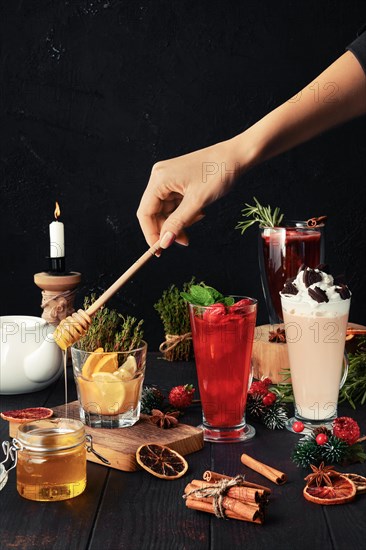 Composition with herbal and fruit tea with ingredients on the table