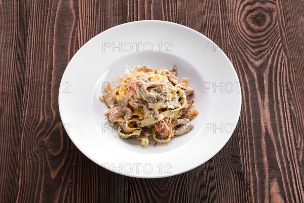 Pasta with bacon and squid