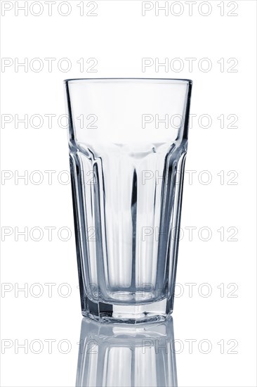 Empty transparent cuba libre glass with reflection isolated on white