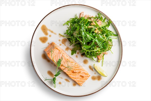 Steamed salmon with arugula and shrimps garnish