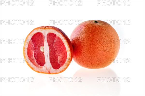 Fresh red grapefruit isolated on white background