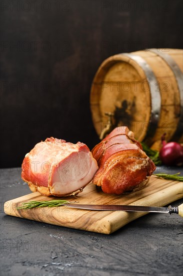 Smoked lamb meat on wooden cutting board