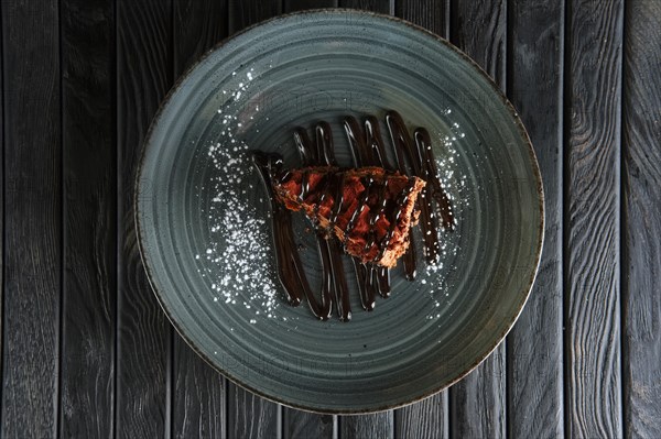 Piece of puffy chocolate cake and souffle. Top view