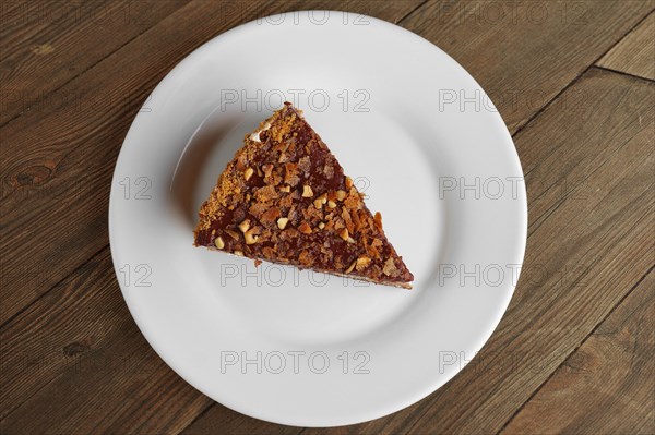 Top view of chocolate sliced cake on wooden table