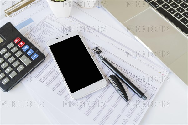 Desk office accountant with calculator smartphone