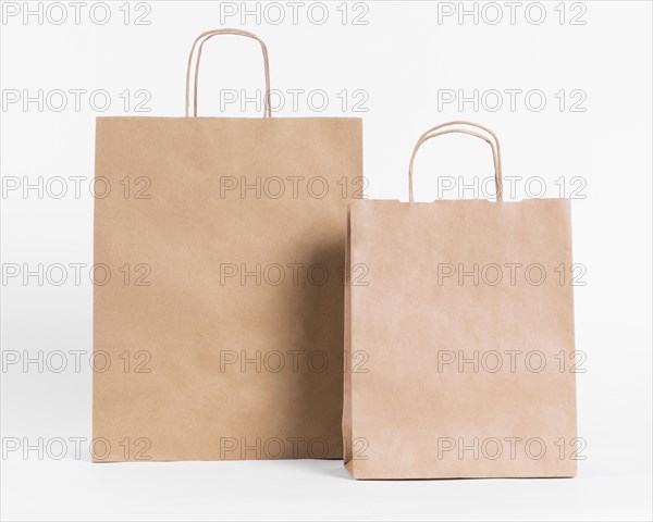 Front view brown paper carrier bags for shopping