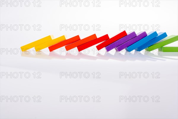 Colorful Domino Blocks in a line on a white background