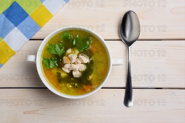 Top view of table with served fish soup